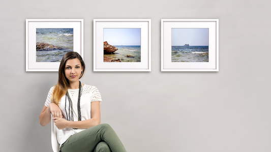 Beehive Picture Hangers, Girl in a chair in front of wall art